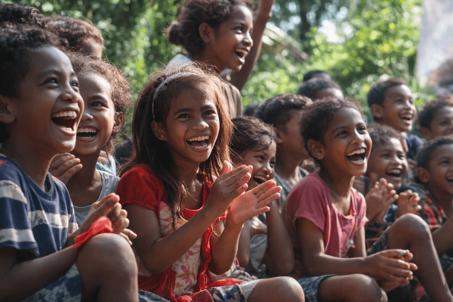 Timorese children clapping and laughing together